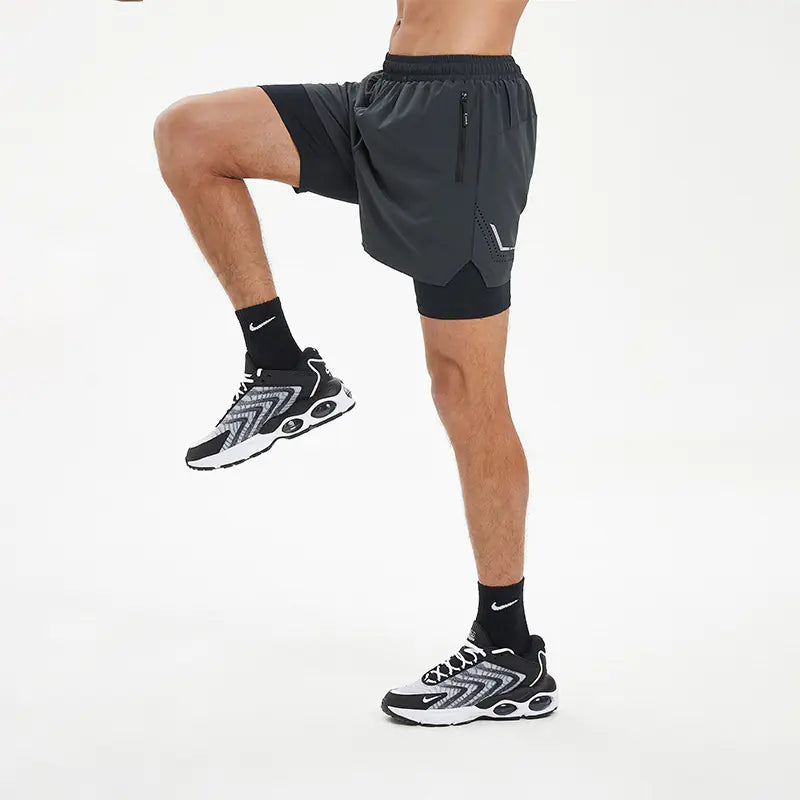 Herre-løbeshorts i to-i-én med hurtigtørrende materiale