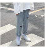 Lige, løstsiddende jeans med slid til mænd - StilNord