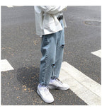 Lige, løstsiddende jeans med slid til mænd - StilNord