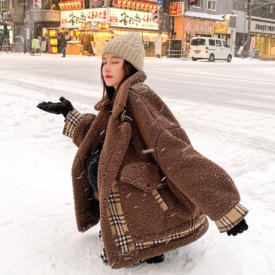 Quiltet lammeuldsfrakke med syningsdetaljer - StilNord